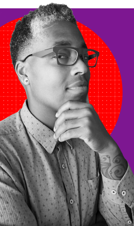 Saifa's headshot. A Black trans intersex man in thick-rimmed glasses and a buttondown shirt. Saifa holds his chin in his hand.